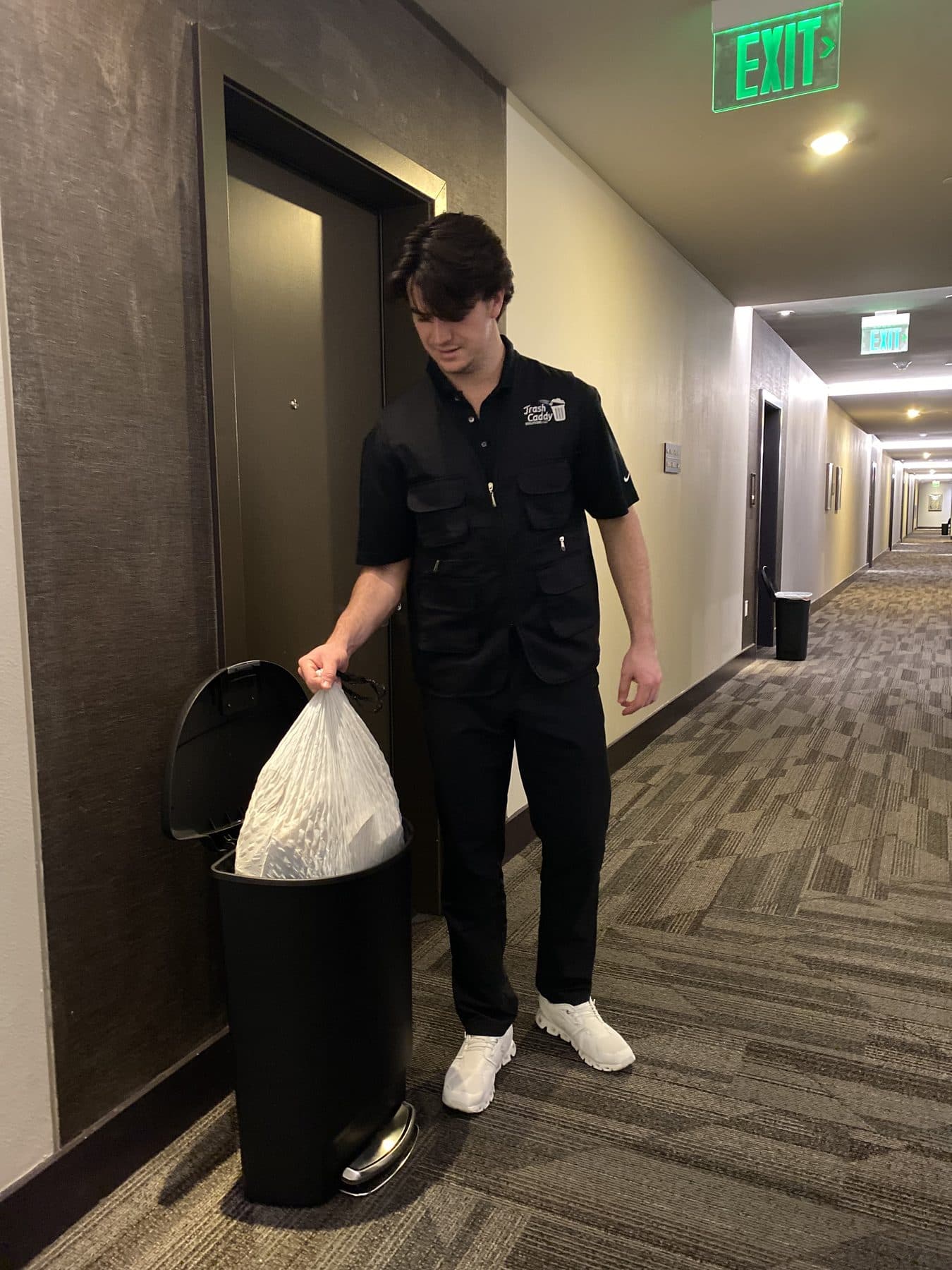 Trash Caddy Solutions team member performing valet trash service at a Dallas apartment community